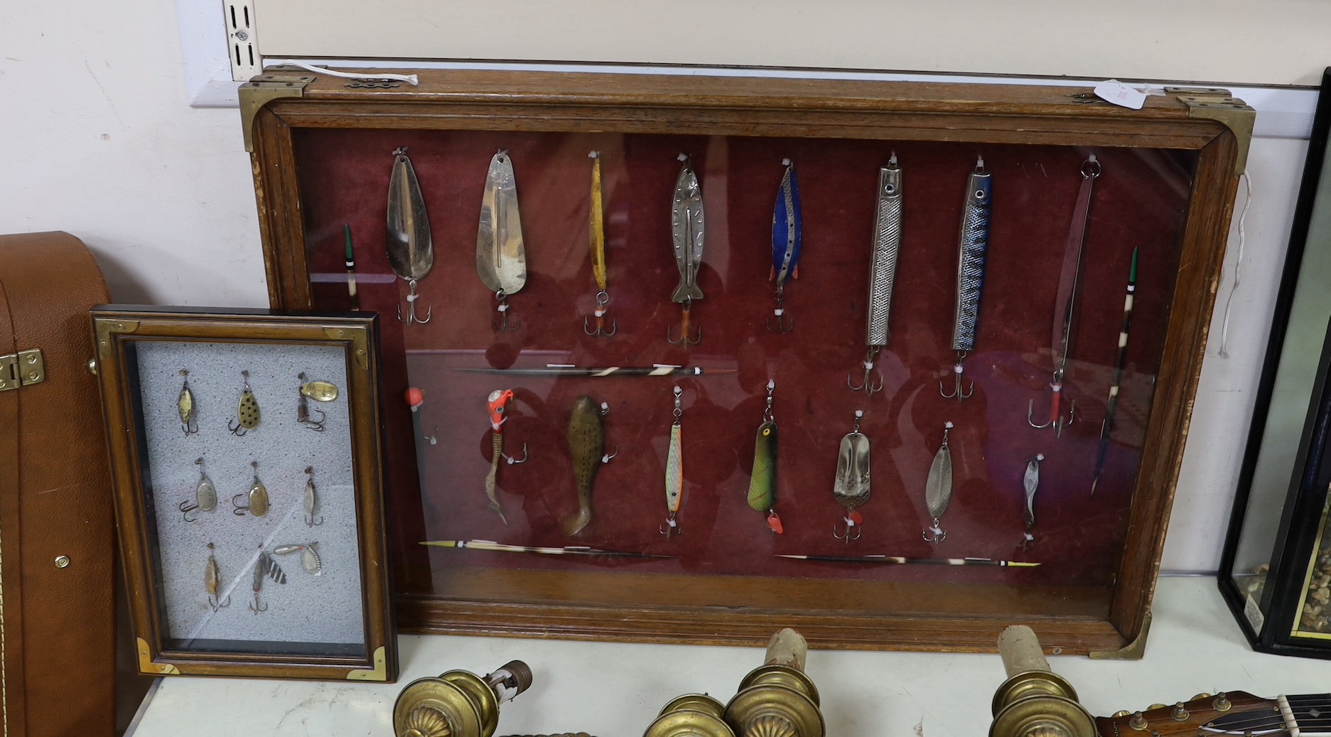 Two cased sets of fishing lures